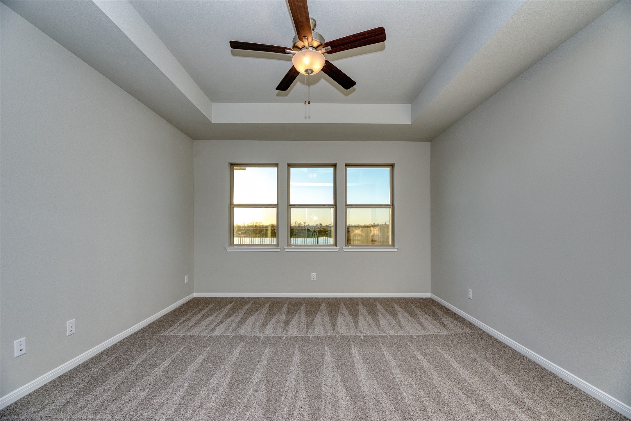 21122 Sunlight Grv Drive Rosharon, TX 77583 - Photo 29 of 45 an empty room with a window and a ceiling fan