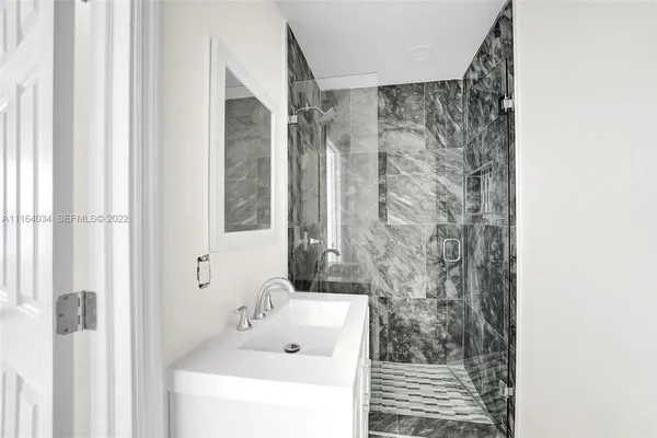 a bathroom with a bathtub and shower