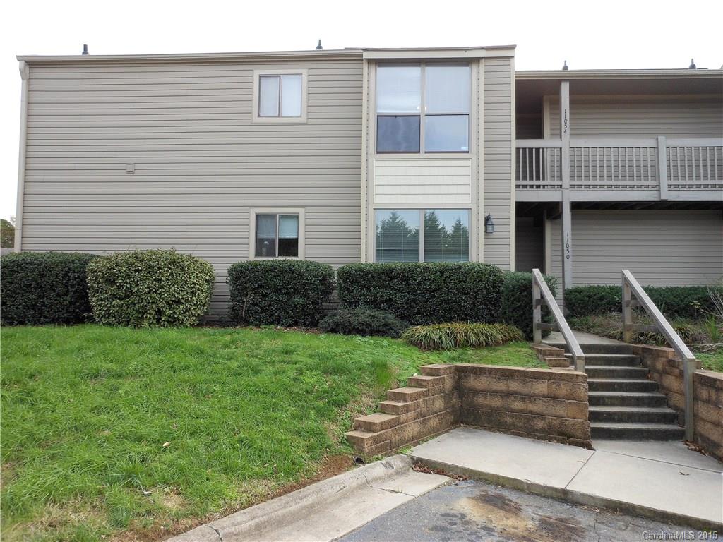 11054 Running Ridge Road, Unit 8415 Charlotte, NC 28226 - Photo 1 of 24 a front view of a house with garden