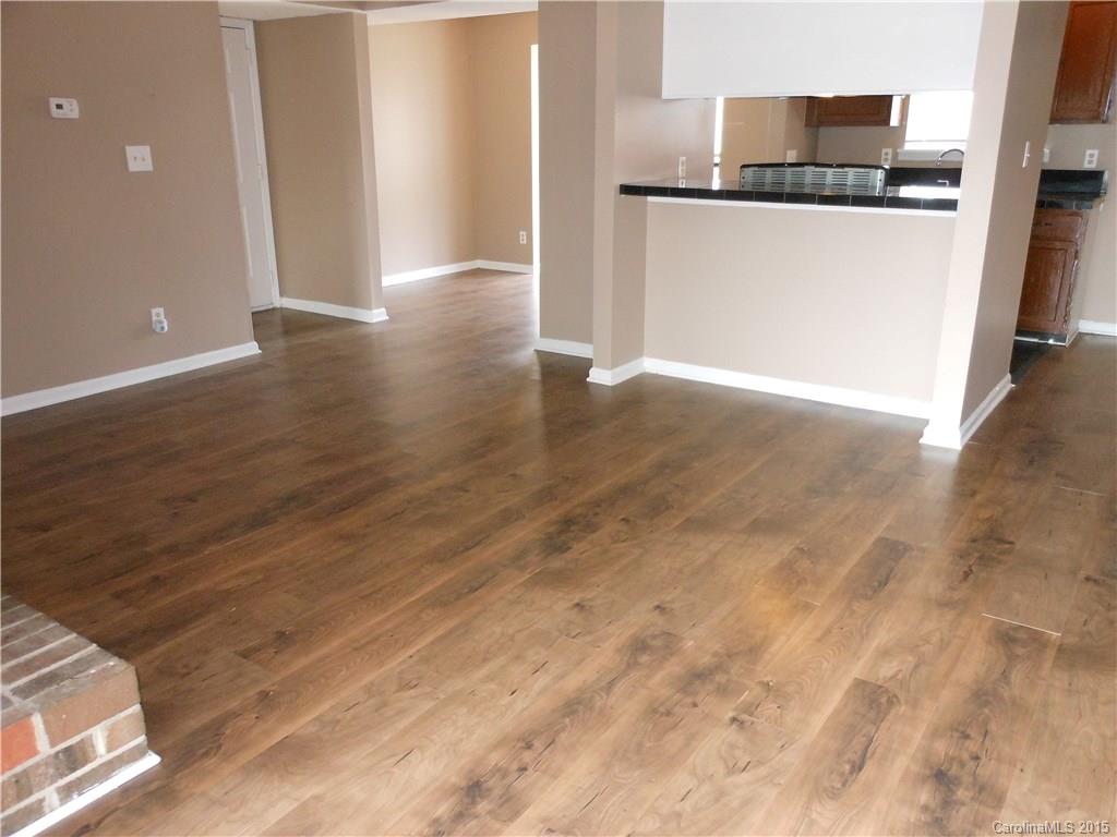 11054 Running Ridge Road, Unit 8415 Charlotte, NC 28226 - Photo 2 of 24 a view of a kitchen with wooden floor