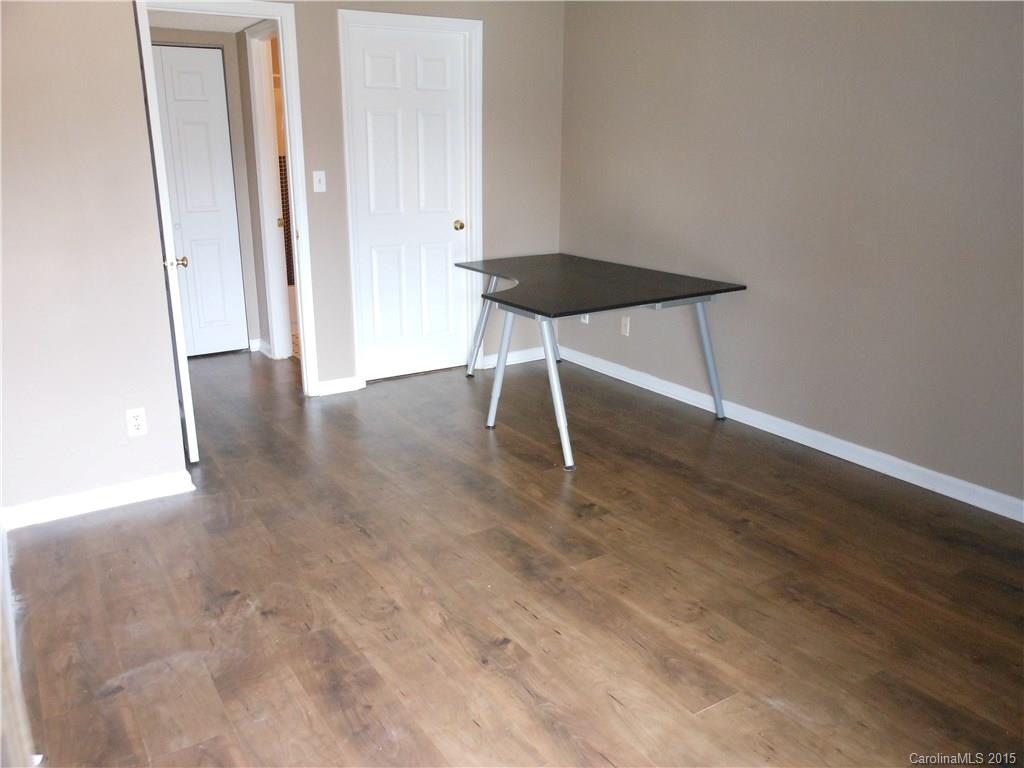 11054 Running Ridge Road, Unit 8415 Charlotte, NC 28226 - Photo 14 of 24 wooden floor in an empty room