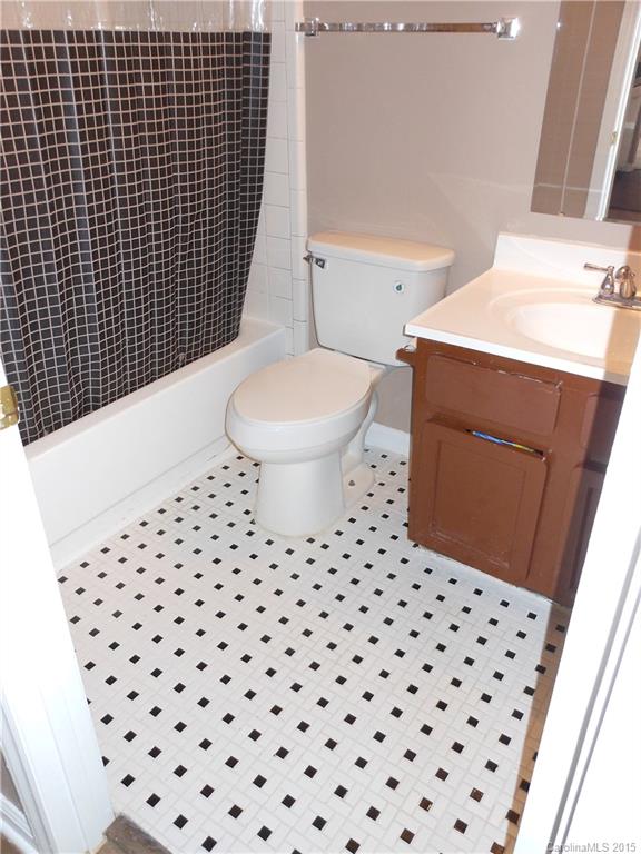 11054 Running Ridge Road, Unit 8415 Charlotte, NC 28226 - Photo 15 of 24 a bathroom with a sink toilet and shower