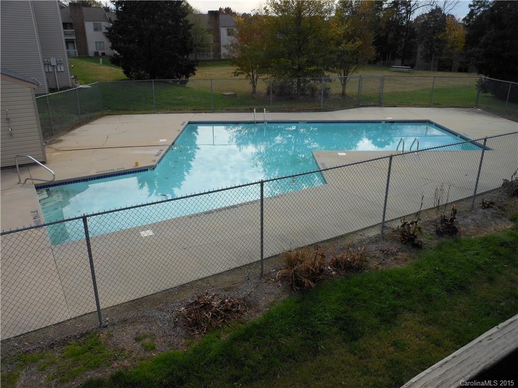 11054 Running Ridge Road, Unit 8415 Charlotte, NC 28226 - Photo 18 of 24 a view of a backyard
