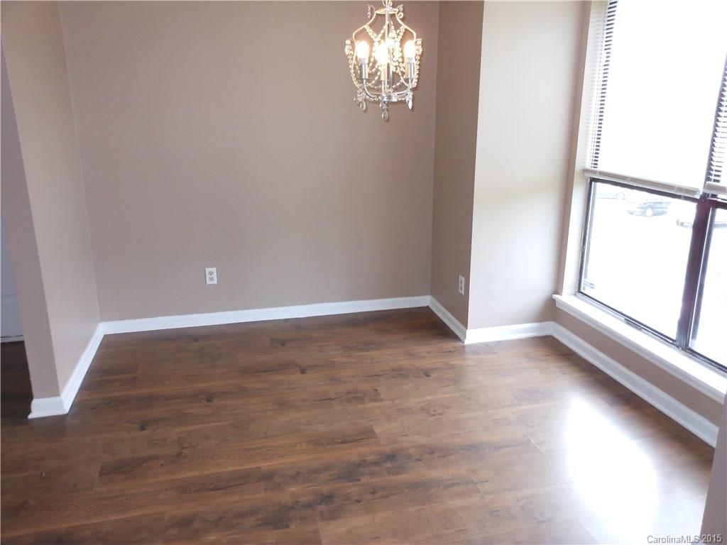 11054 Running Ridge Road, Unit 8415 Charlotte, NC 28226 - Photo 8 of 24 a view of an empty room with a window