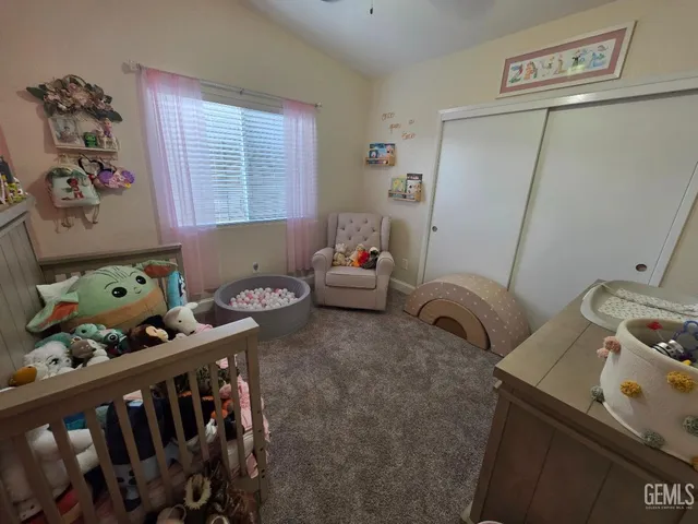 a living room with furniture chess table and a window