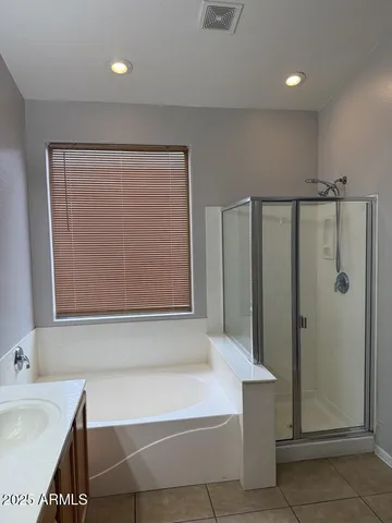a bathroom with a bathtub and a sink