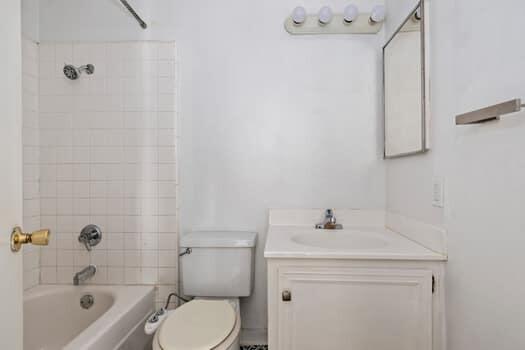 5940 Birch Street, Unit 2 Carpinteria, CA 93013 - Photo 13 of 17 a bathroom with a sink toilet and shower