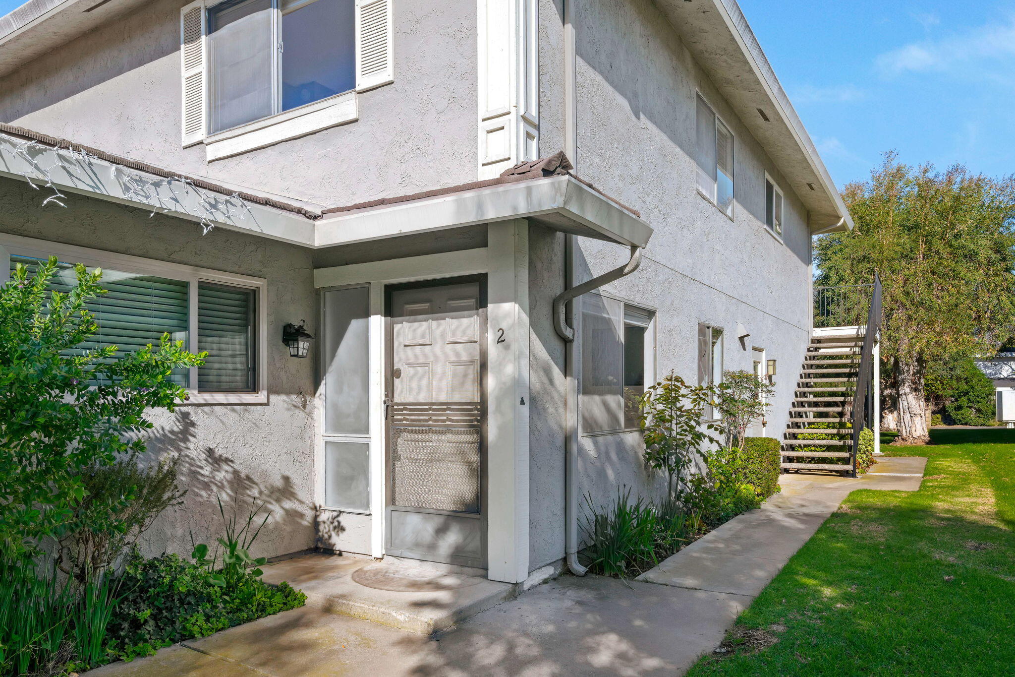 5940 Birch Street, Unit 2 Carpinteria, CA 93013 - Photo 2 of 17 a view of a house with backyard and garden