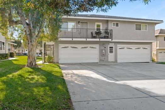 5940 Birch Street, Unit 2 Carpinteria, CA 93013 - Photo 3 of 17 a front view of a house with a yard and garage
