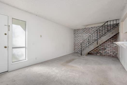 5940 Birch Street, Unit 2 Carpinteria, CA 93013 - Photo 4 of 17 a view of an empty room with stairs