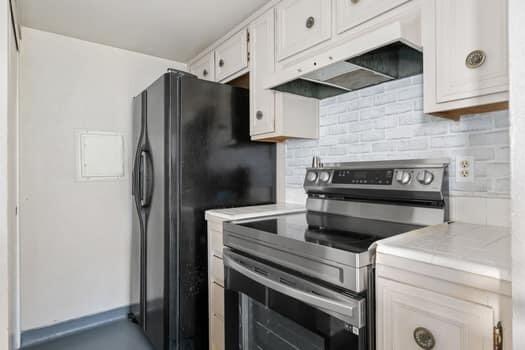 5940 Birch Street, Unit 2 Carpinteria, CA 93013 - Photo 9 of 17 a kitchen with a refrigerator and a stove