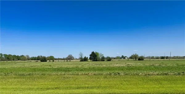 a yard with lots of green space