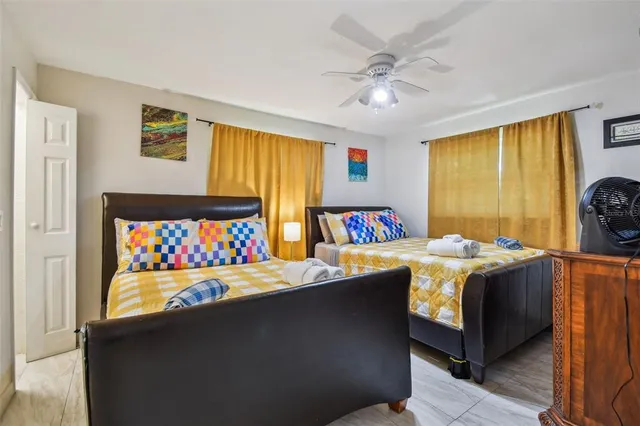 a bedroom with a bed and a table in it