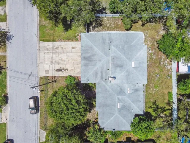 an aerial view of residential house with outdoor space