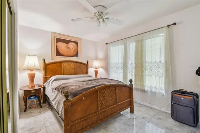 a bedroom with a bed and window