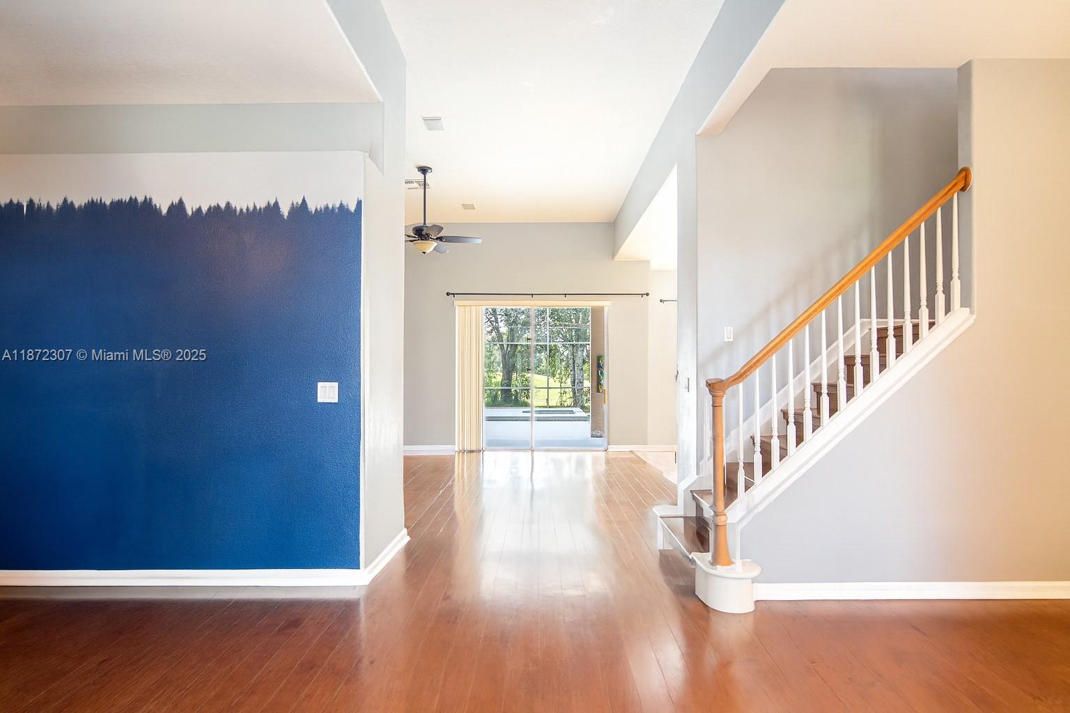 565 Hebrides Court Apopka, FL 32712 - Photo 13 of 32 a view of an entryway with wooden floor