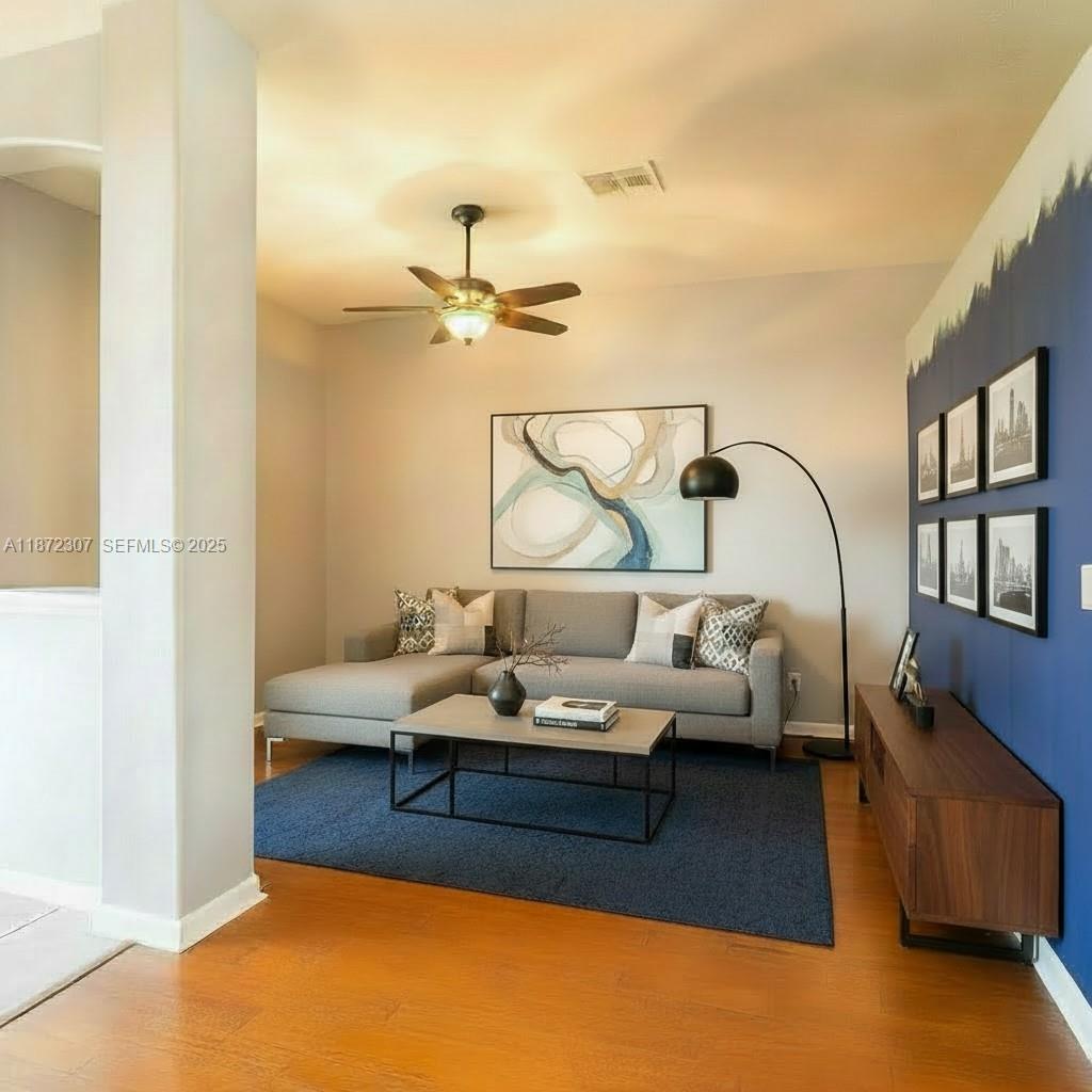 565 Hebrides Court Apopka, FL 32712 - Photo 14 of 32 a living room with furniture and a window