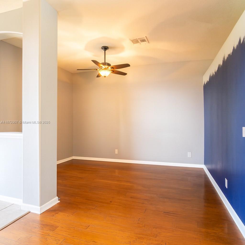 565 Hebrides Court Apopka, FL 32712 - Photo 15 of 32 a view of a room with wooden floor