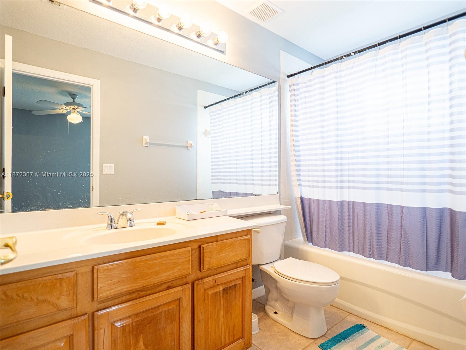 565 Hebrides Court Apopka, FL 32712 - Photo 20 of 32 a bathroom with a sink a toilet and tub