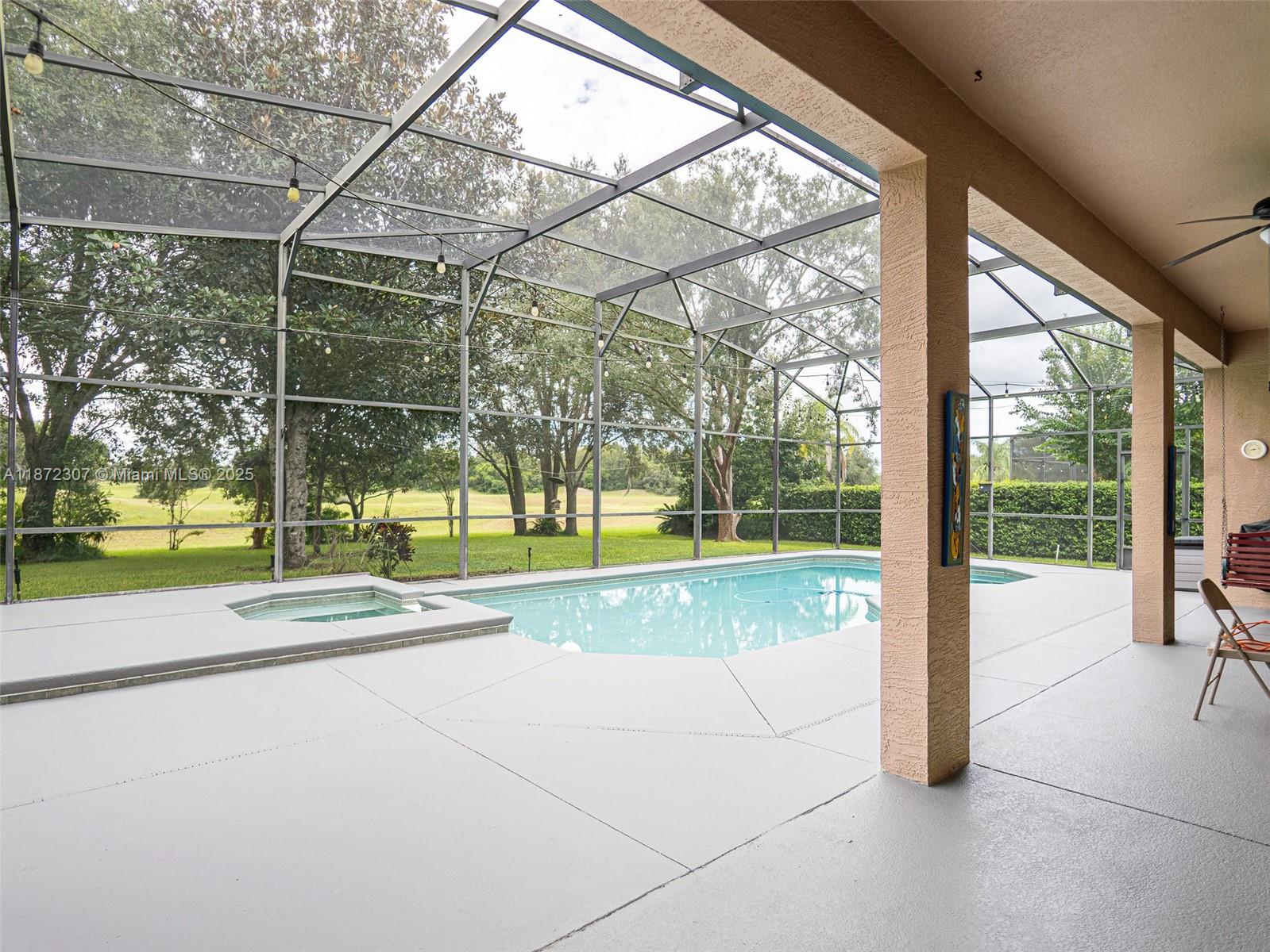 565 Hebrides Court Apopka, FL 32712 - Photo 28 of 32 a view of a swimming pool with a porch