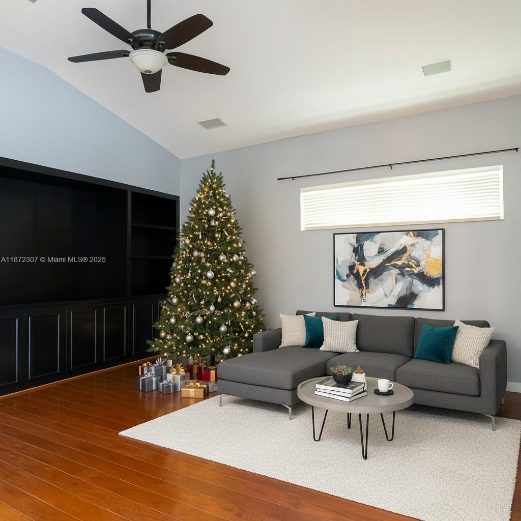 565 Hebrides Court Apopka, FL 32712 - Photo 7 of 32 a living room with furniture and a potted plant