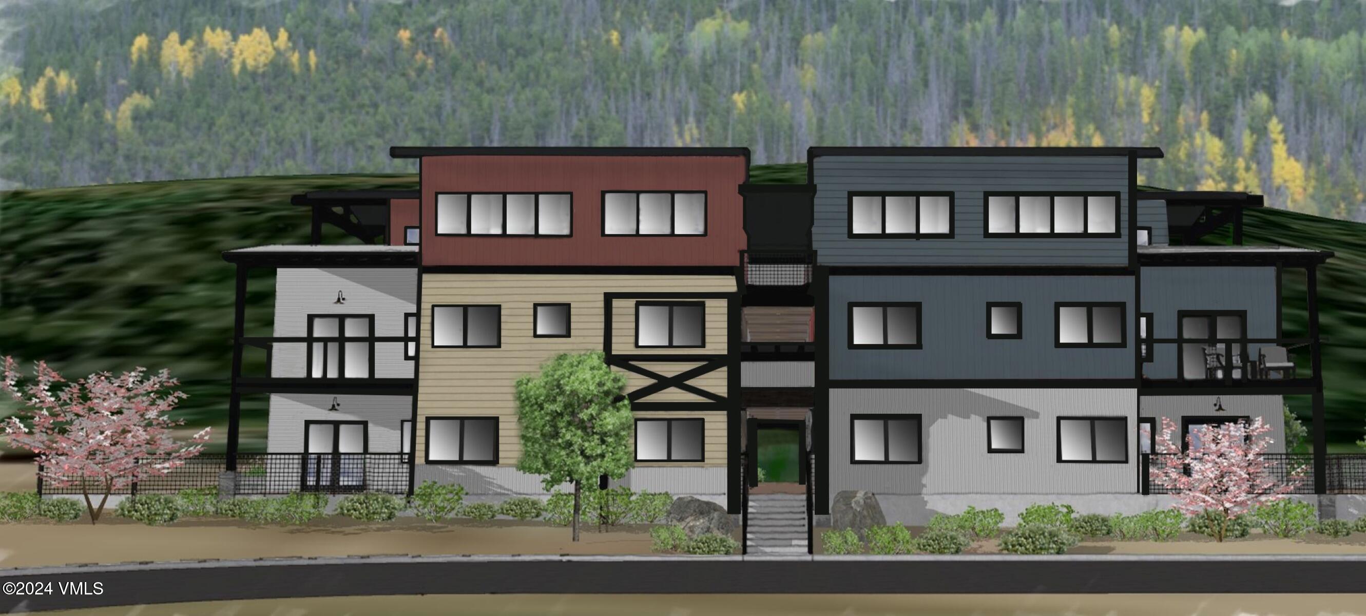 36 Abby Road, Unit 2C Minturn, CO 81645 - Photo 3 of 6 front view of a brick house with a yard