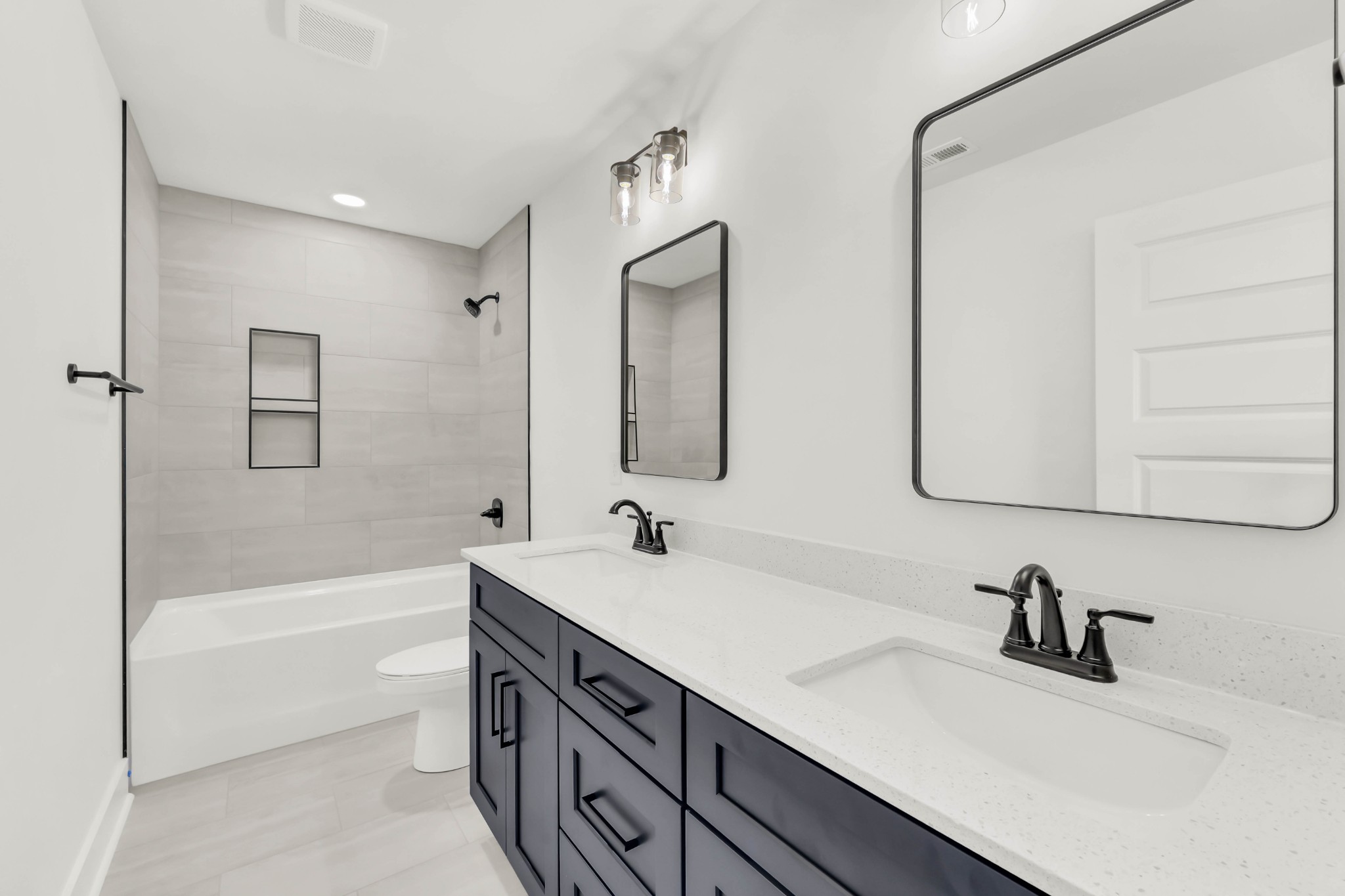 352 Front Rdg Circle Clarksville, TN 37042 - Photo 20 of 29 a bathroom with a double vanity sink a mirror and a bathtub