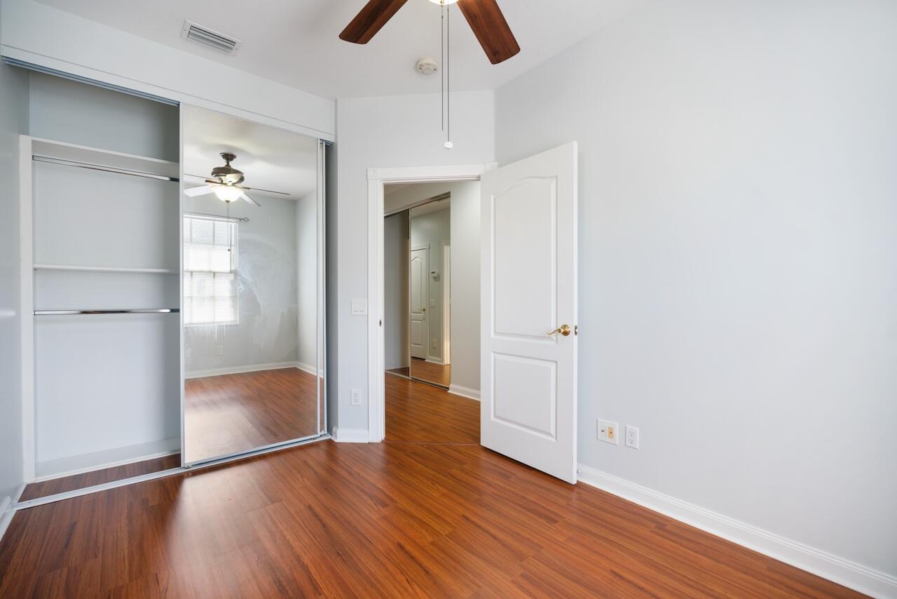 329 Legare Court Jupiter, FL 33458 - Photo 14 of 23 a view of empty room with wooden floor
