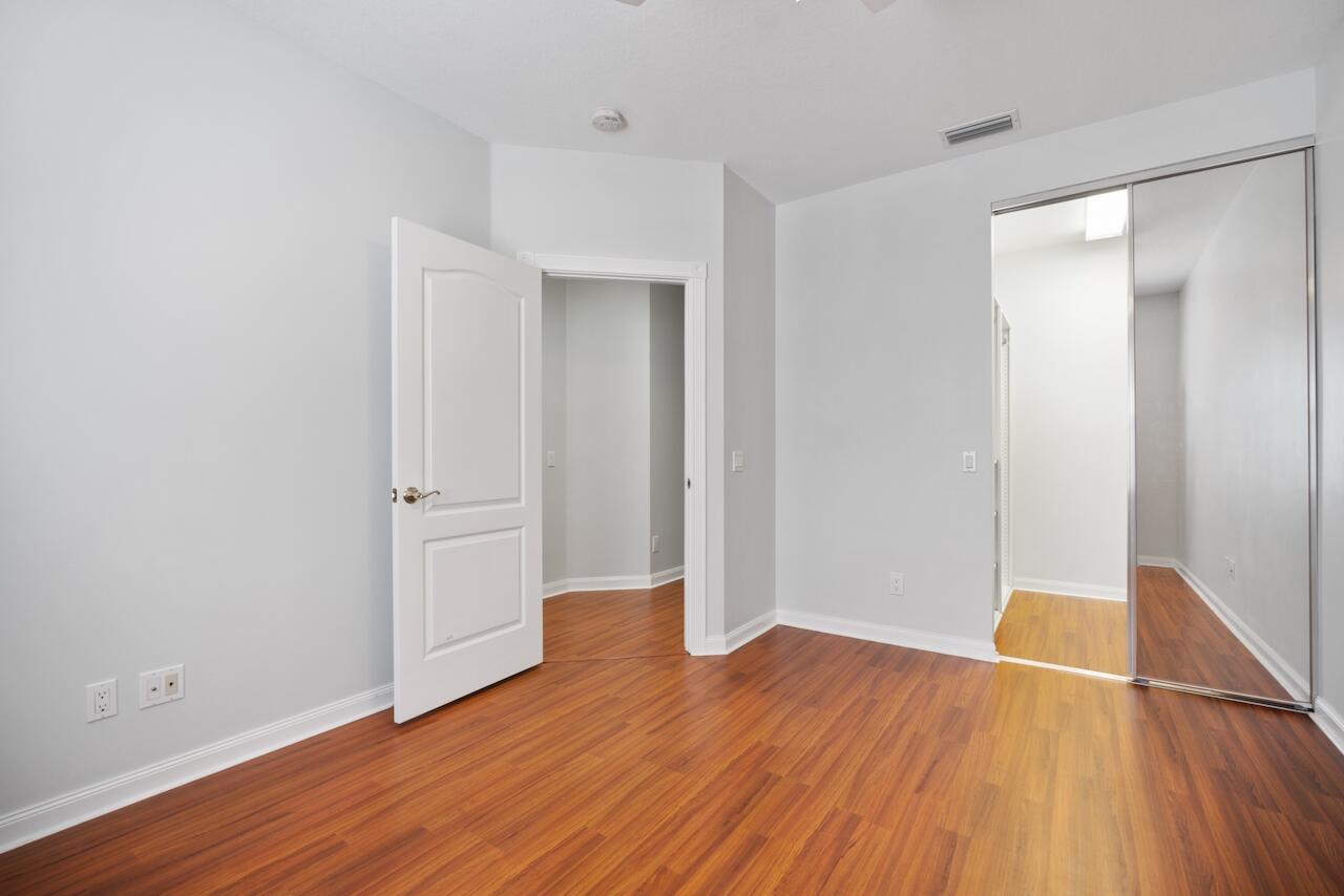 329 Legare Court Jupiter, FL 33458 - Photo 17 of 23 a view of empty room with wooden floor