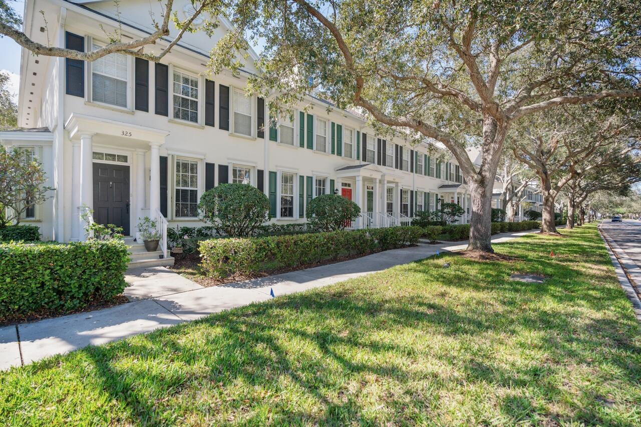 329 Legare Court Jupiter, FL 33458 - Photo 2 of 23 a view of a big yard with plants and large trees