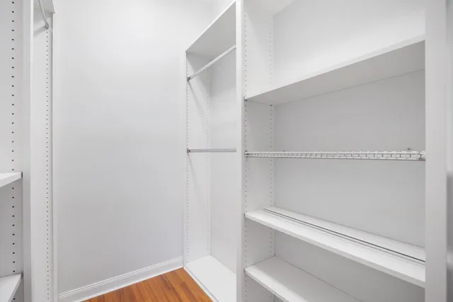 a view of an empty walk in closet