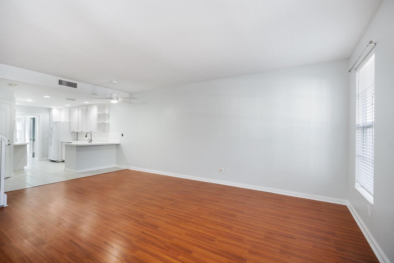 329 Legare Court Jupiter, FL 33458 - Photo 4 of 23 a view of a kitchen with wooden floor and a window