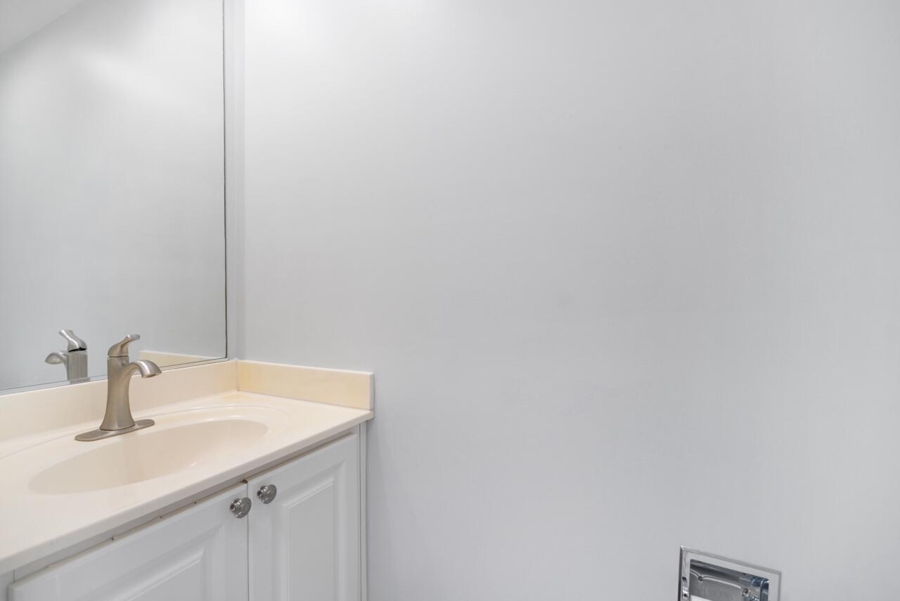 329 Legare Court Jupiter, FL 33458 - Photo 7 of 23 a bathroom with a sink and vanity