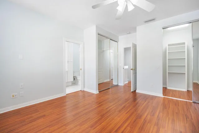 an empty room with wooden floor