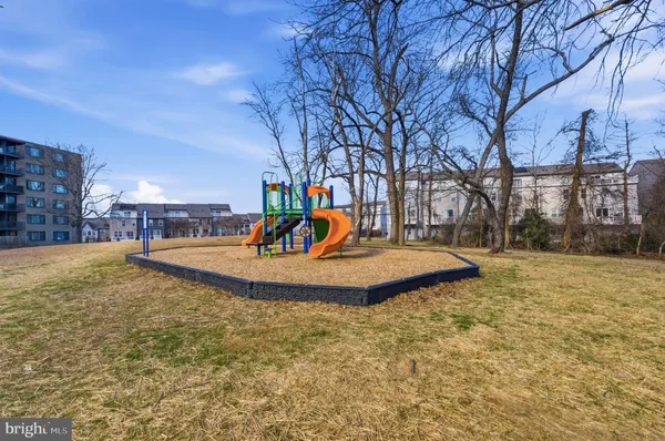 a view of a playground with basketball court