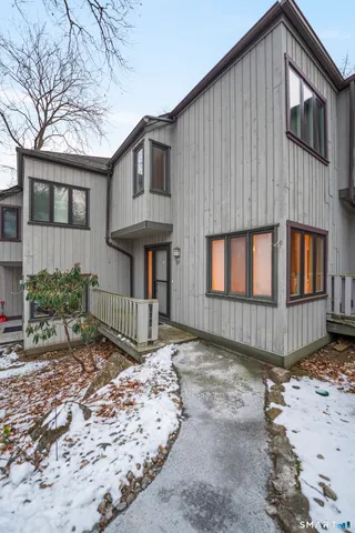 a picture of a bench in front of a door