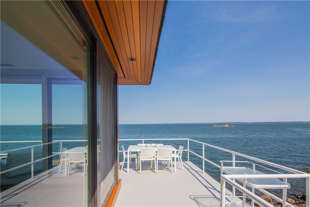 a view of balcony with furniture