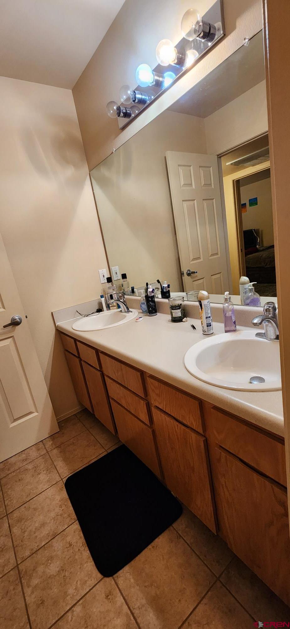 1100 Goeglein Gulch Road, Unit 162 Durango, CO 81301 - Photo 20 of 34 a bathroom with a sink and a mirror