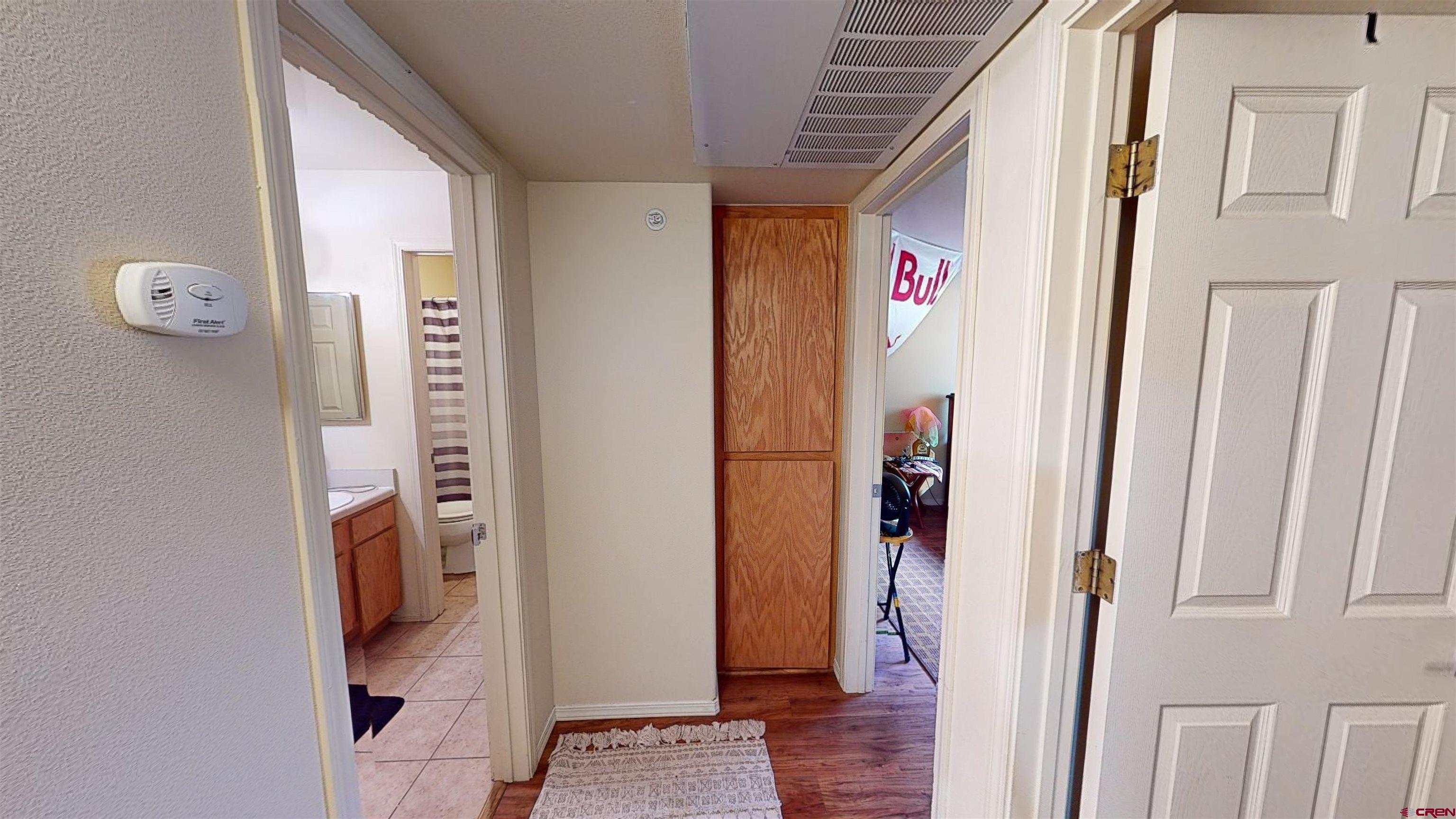 1100 Goeglein Gulch Road, Unit 162 Durango, CO 81301 - Photo 22 of 34 a view of hallway with wooden floor