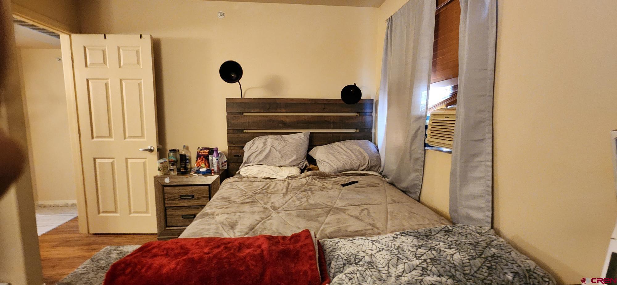 1100 Goeglein Gulch Road, Unit 162 Durango, CO 81301 - Photo 25 of 34 a bedroom with a bed and a window