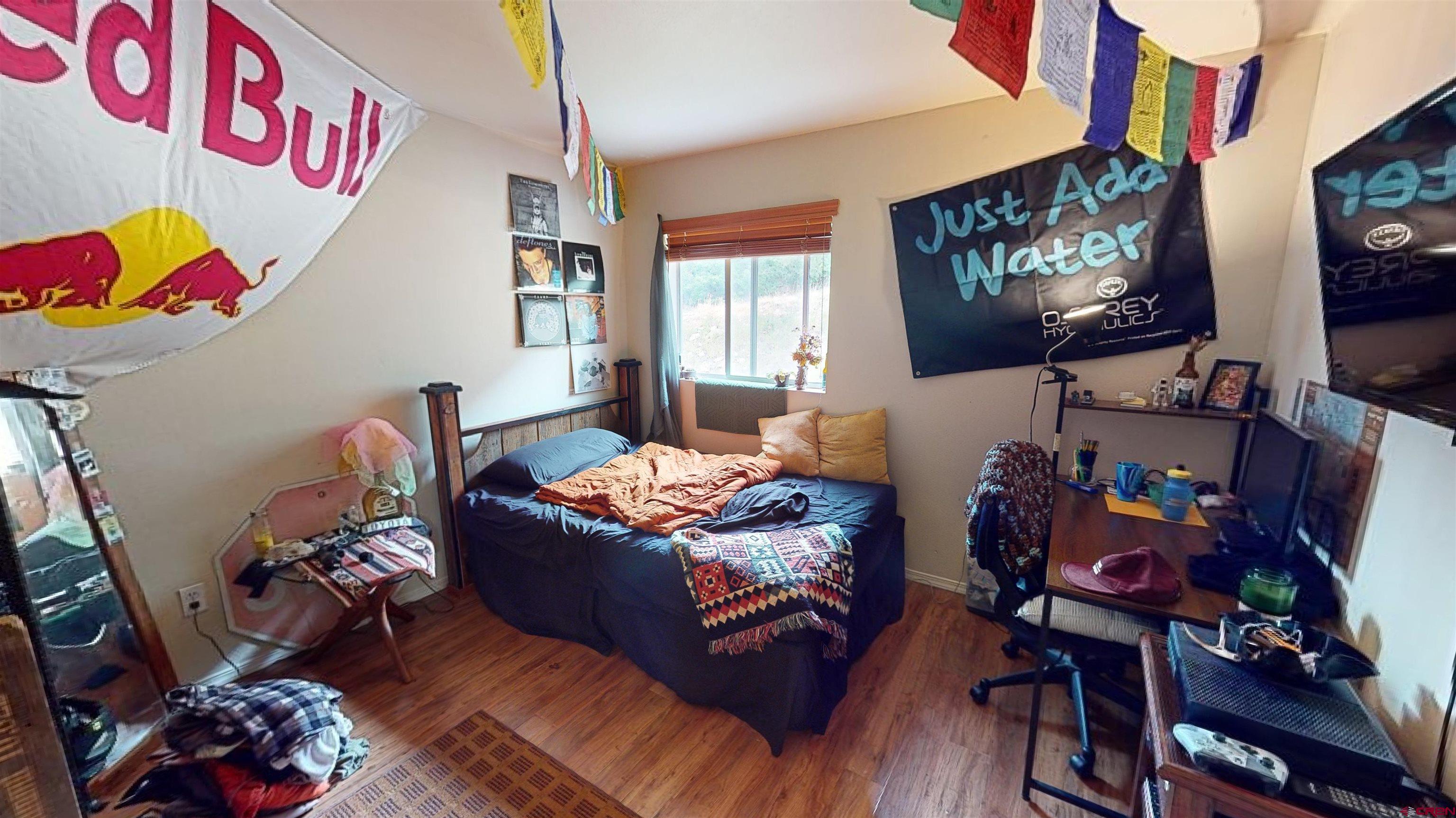 1100 Goeglein Gulch Road, Unit 162 Durango, CO 81301 - Photo 27 of 34 a living room with furniture and a flat screen tv
