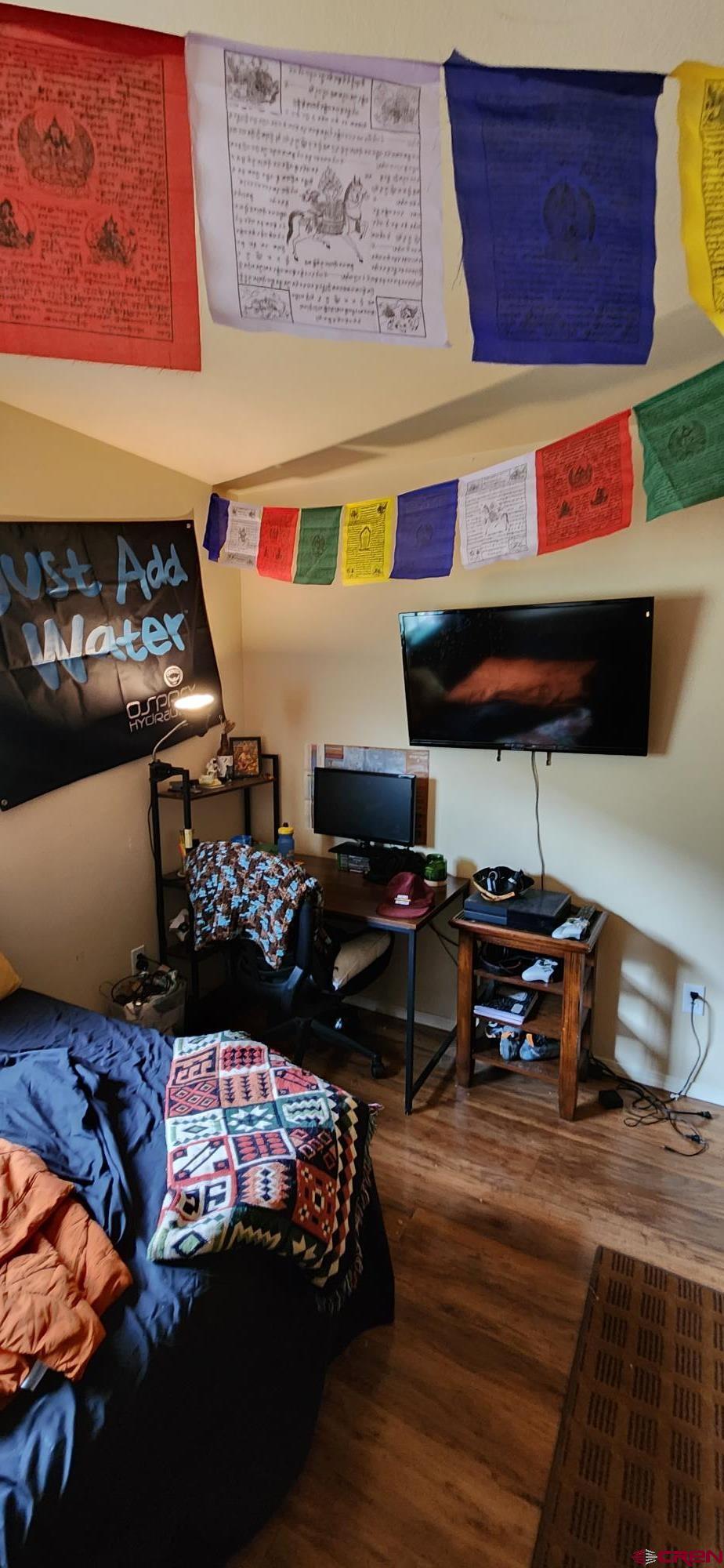 1100 Goeglein Gulch Road, Unit 162 Durango, CO 81301 - Photo 30 of 34 a living room with furniture a rug and a fireplace