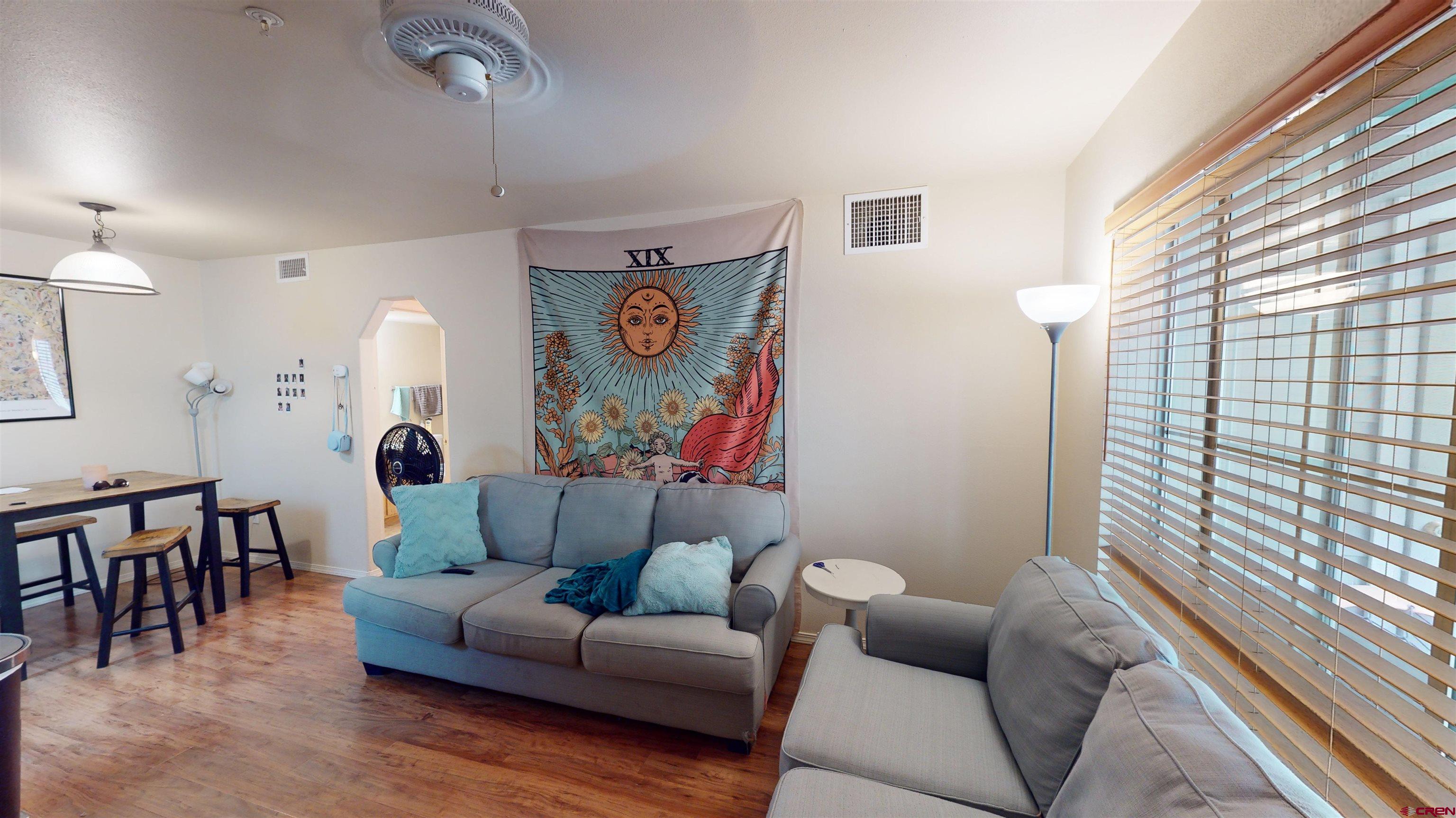 1100 Goeglein Gulch Road, Unit 162 Durango, CO 81301 - Photo 3 of 34 a living room with furniture and a large window