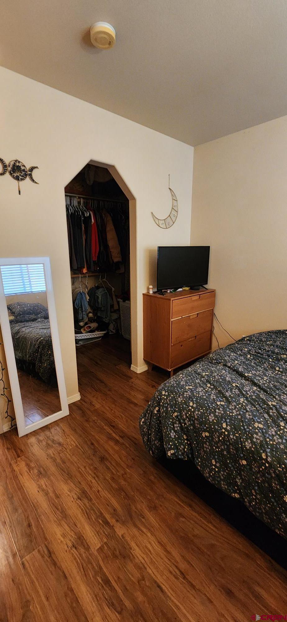 1100 Goeglein Gulch Road, Unit 162 Durango, CO 81301 - Photo 10 of 34 a bedroom with a bed and a television