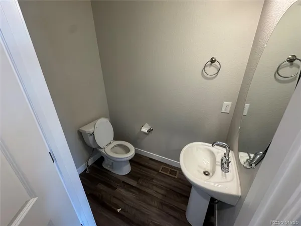 a bathroom with a toilet and a sink