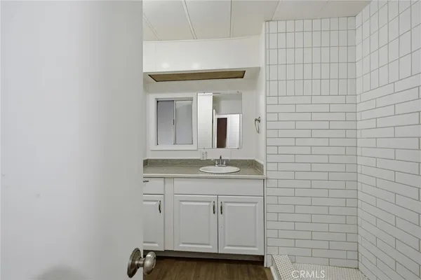 a bathroom with a sink and a mirror