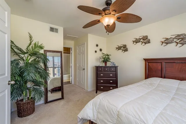 a bathroom with a granite countertop double vanity sink and mirror