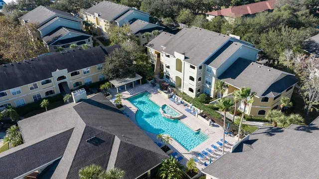 an aerial view of houses with outdoor space