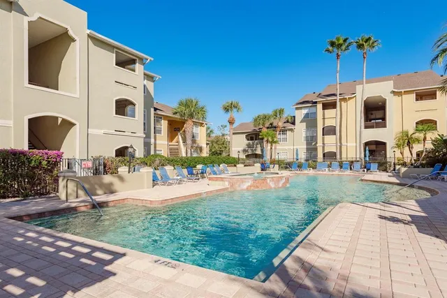 a view of a building with a yard