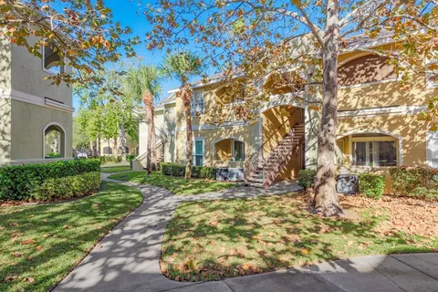 a front view of a house with outdoor seating